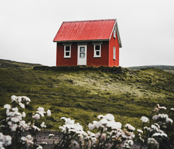 A little red house on a hill